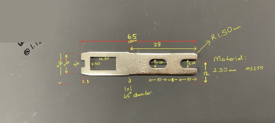 Measured flat steel component with handwritten dimensions and notes