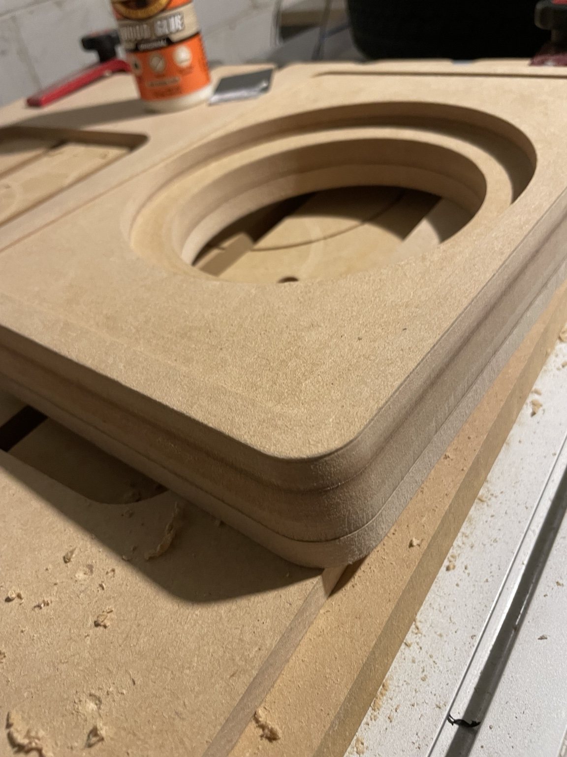 Close-up of CNC routing and laminated MDF layers on the speaker enclosure